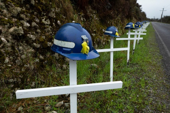 29 crosses with mine helmets on the road which leads to the Pike River Mine portal. Photo / Brett Phibbs