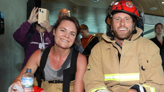 Broadcaster Heather du Plessis-Allan, left, and NZ Breakers chief executive Matt Walsh, centre, after taking part in the Firefighter Sky Tower Stair Challenge. Photo / Supplied