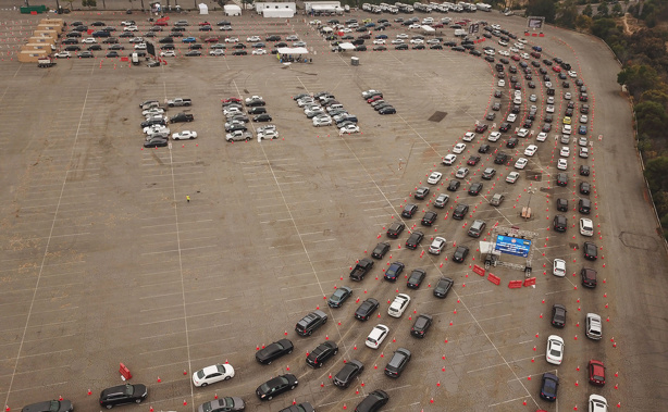 This aerial view shows people waiting in line in their cars at a Covid-19 testing site at Dodger Stadium in Los Angeles, California, Nov. 18.