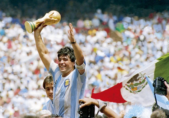 Diego Maradona of Argentina holds the World Cup trophy after defeating West Germany 3-2 during the 1986 FIFA World Cup Final in Mexico. Photo / Getty