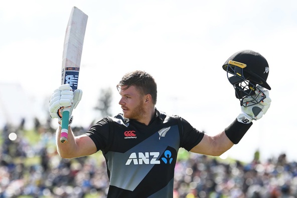 Glenn Phillips celebrates his maiden - and record - T20 century. Photo / Photosport
