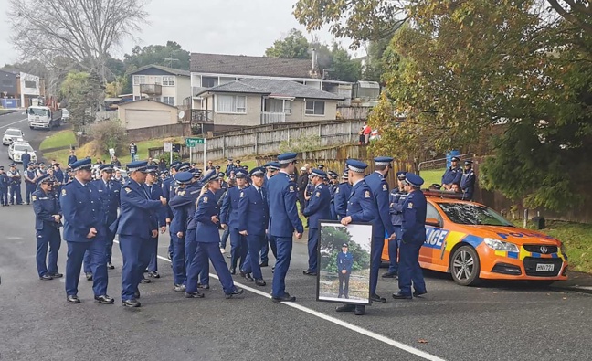 The family of slain policeman Matthew Hunt and colleagues marched to remember him near where he was shot dead. Photo / NZ Herald