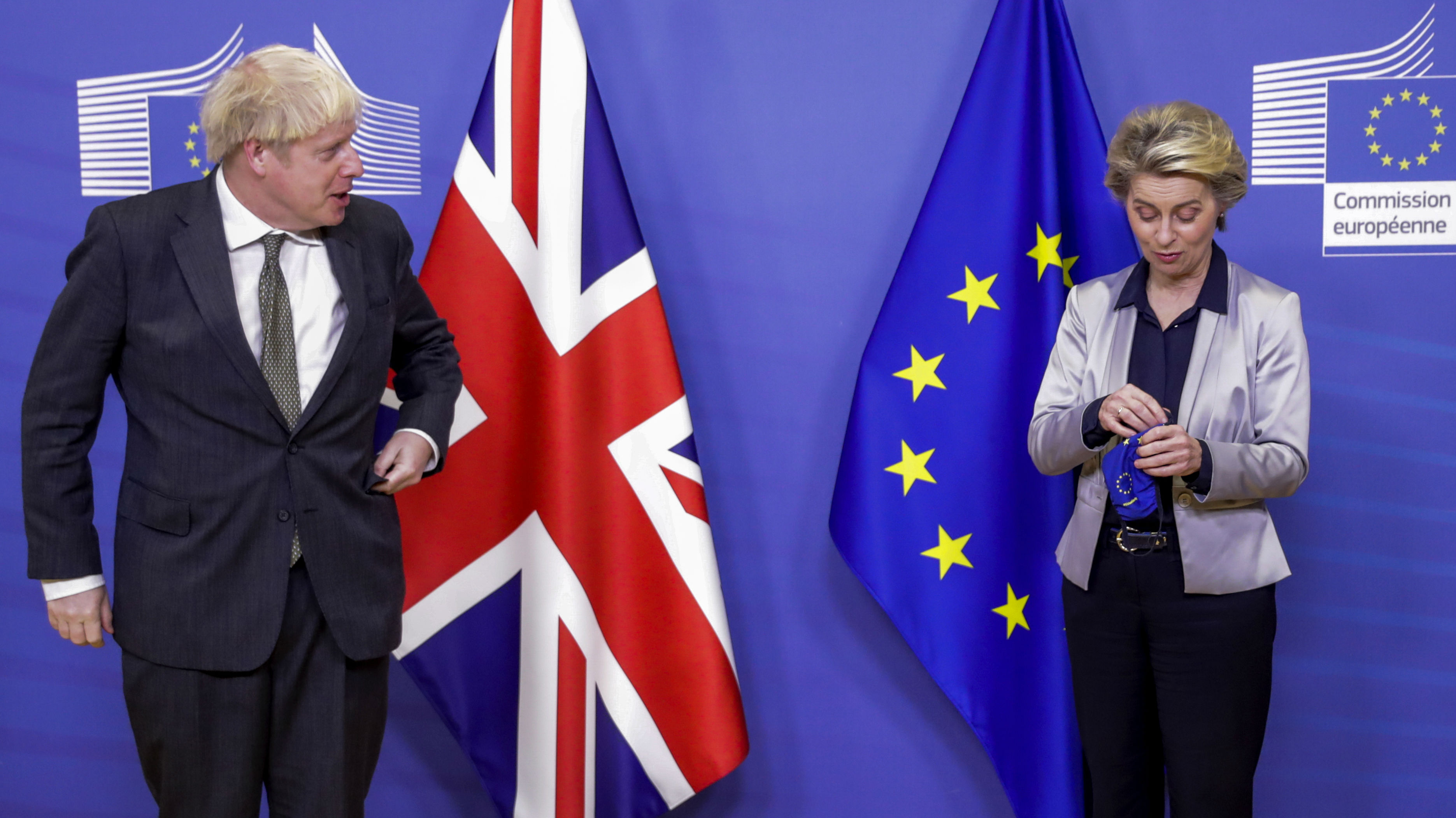 European Commission President Ursula von der Leyen, right, welcomes British Prime Minister Boris Johnson prior to a meeting at EU headquarters in Brussels. (Photo / AP)