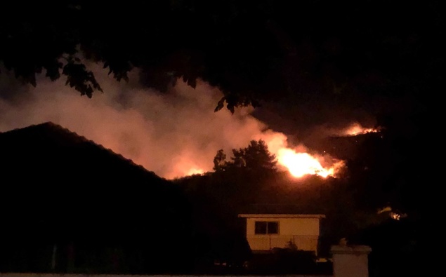The fire in the Port Hills is above the Hillsborough suburb in Christchurch. Photo / Hamish Clark
