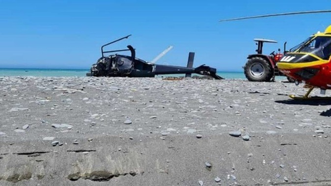 The crash scene of a Eurcopter helicopter from Glenloch Helicopters lies on the beach at the mouth of the Kekerengu River, north of Kaikoura. Photo / Supplied