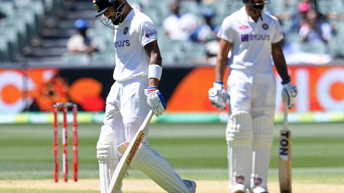 India's Virat Kohli departs as part of their lowest test score. Photo / AP