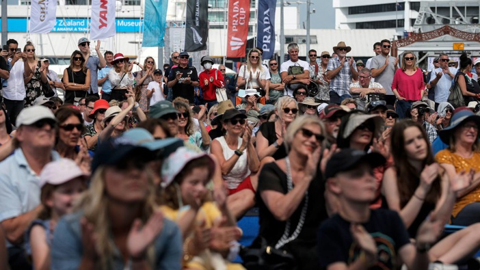 Crowds on the waterfront viaduct in Auckland gather without social distancing to watch America's Cup racing. (Photo / Alex Burton)