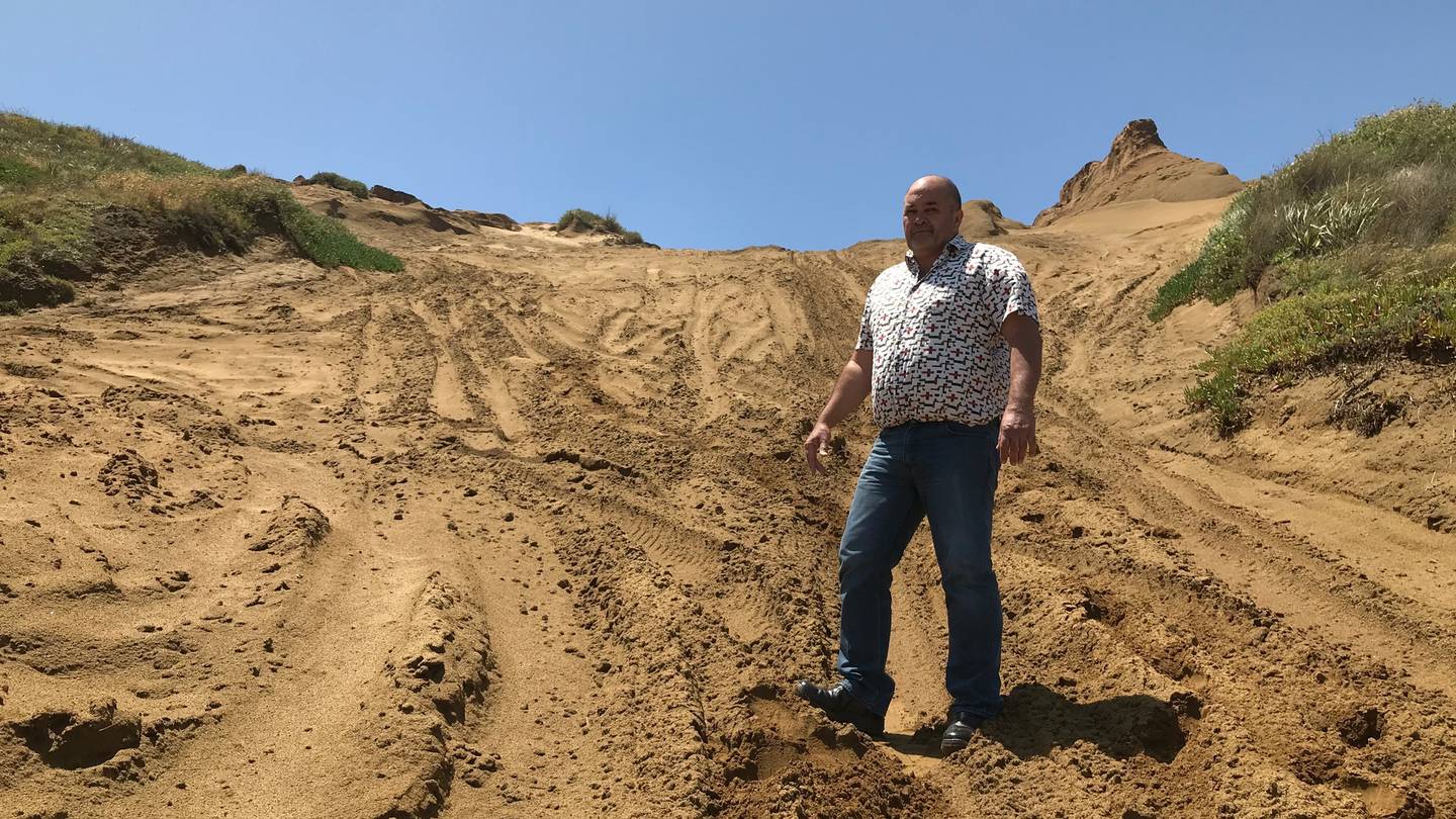 Kaipara District Councillor David Wills at Mahuta Gap where constant four wheel driving has damaged sand dune vegetation. Photo / Susan Botting