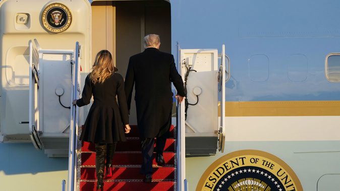 President Donald Trump and first lady Melania Trump, board Air Force One on way to the Mar-a-Lago resort.