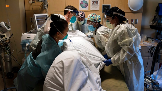 Medical staff in California treat a Covid-19 patient. (Photo / AP)