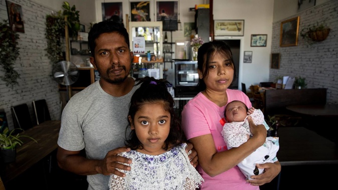 Rockys owner Rocky Warnakulasuriya with his wife Jeevani Thusitha and daughters Sophie age 9 and Layla age 12 days at their business in Mt Albert after it was robbed. Photo / Dean Purcell