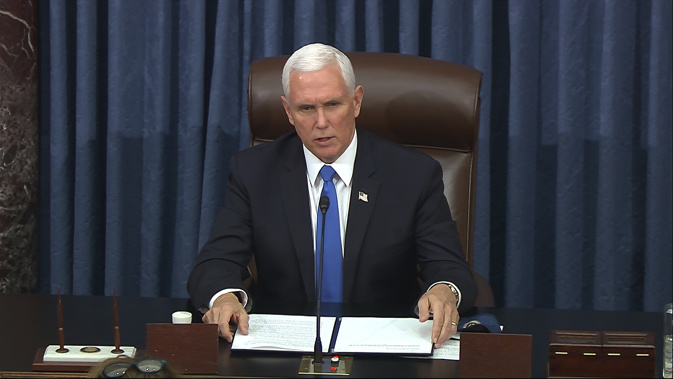 Mike Pence speaks as the Senate reconvenes after protesters stormed into the U.S. Capitol