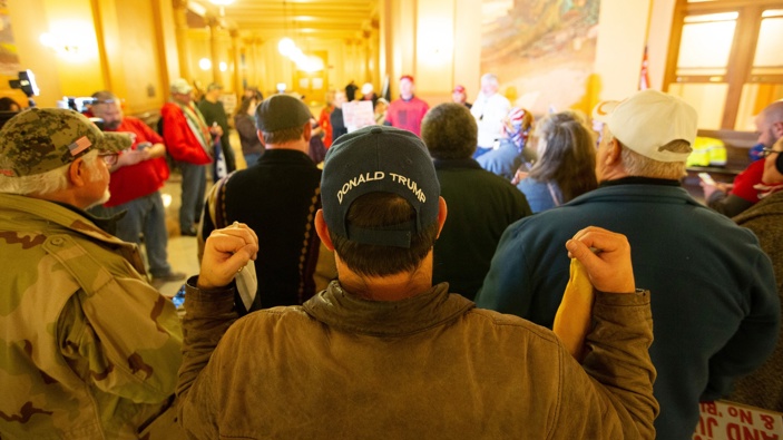 Supporters of President Donald Trump gather inside the Kansas Statehouse. (Photo / AP)