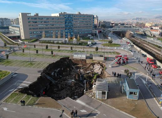 A huge sinkhole swallowed several cars and forced the evacuation of a Covid ward after opening up in the parking lot of a hospital in southern Italy. (Photo / Shutterstock via CNN)