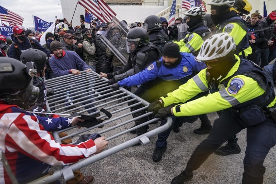 Supporters of President Donald Trump try to break through a police barrier at the US Capitol. Photo / CNN