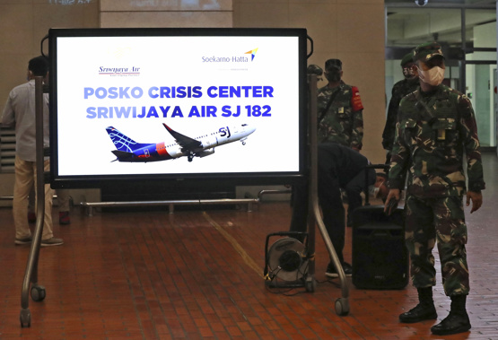 Indonesian soldiers stand near a crisis center set up following a report that a Sriwijaya Air passenger jet has lost contact with air traffic controllers after take off, at Soekarno-Hatta International Airport in Tangerang. Photo / AP