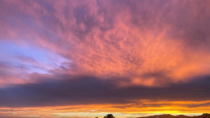 Red sky in the morning: The weather is set to turn across New Zealand as an active front bears down on the country. Photo / Anna Leask