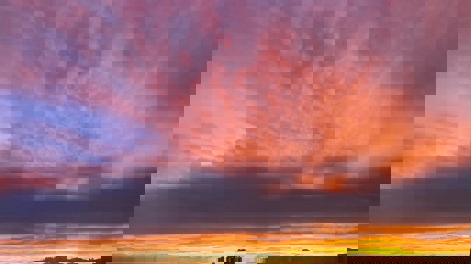 Red sky in the morning: The weather is set to turn across New Zealand as an active front bears down on the country. Photo / Anna Leask