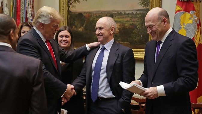 President Donald Trump shakes hands with Chris Liddell. Photo / Getty