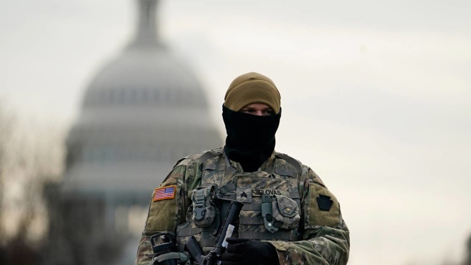A National Guard soldier stands at a roadblock outside the Capitol in Washington DC as security is ramped ahead of US President-elect Joe Biden's inauguration ceremony. Photo / AP