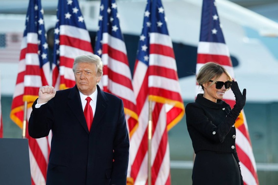 President Donald Trump and first lady Melania Trump wave to supporters after giving a speech at Andrews Air Force Base. Photo / AP