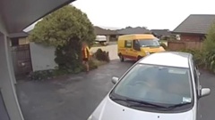 Courier driver drops of package and caught urinating in garden. Video / Supplied