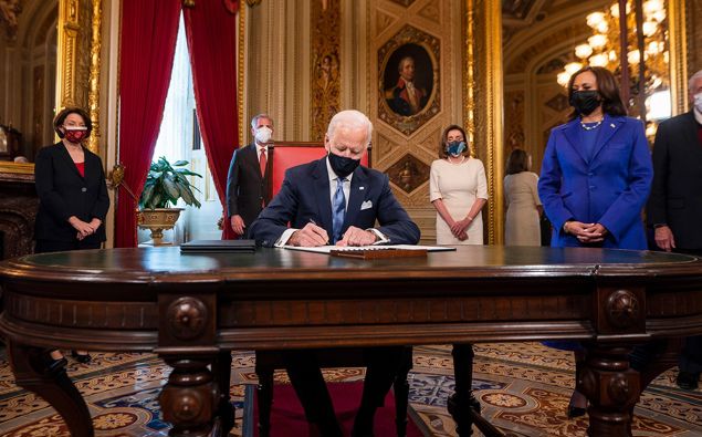 Joe Biden signs three documents including an inauguration declaration, cabinet nominations and sub-cabinet nominations in the President's Room at the US Capitol after the inauguration ceremony