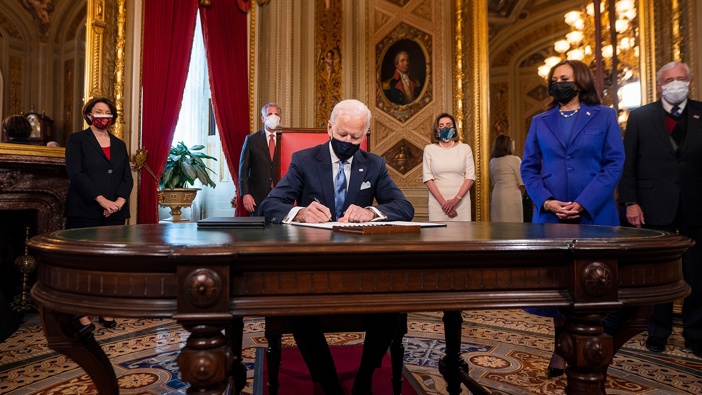 Joe Biden signs three documents including an inauguration declaration, cabinet nominations and sub-cabinet nominations in the President's Room at the US Capitol after the inauguration ceremony