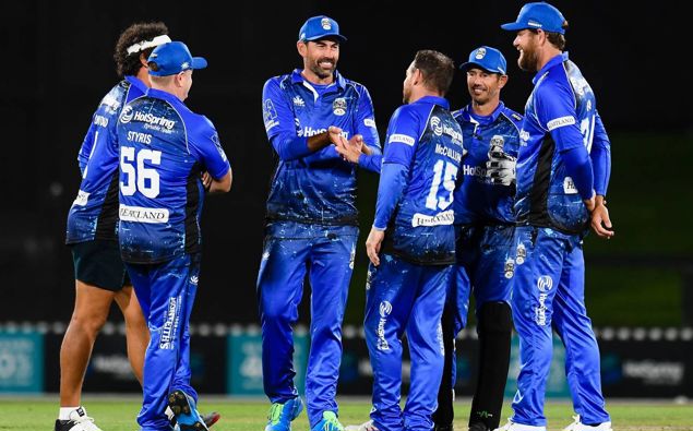 Team Cricket celebrates a wicket during the Black Clash. Photo / Photosport