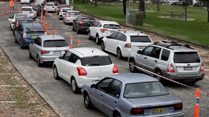 People queue at a drive-through Covid-19 testing station in Sydney on December 19, 2020. Photo / AP