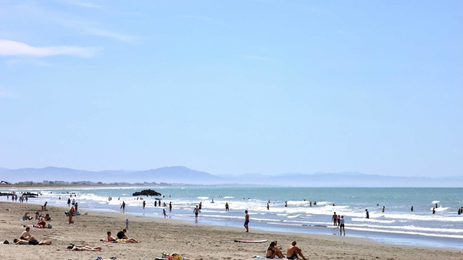 People enjoying the hot weather on Sumner Beach, Christchurch. Photo / George Heard