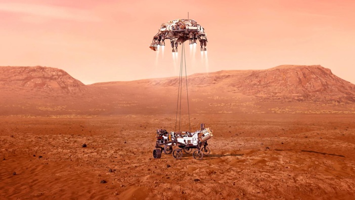 This illustration provided by NASA shows the Perseverance rover, bottom, landing on Mars. Photo / AP