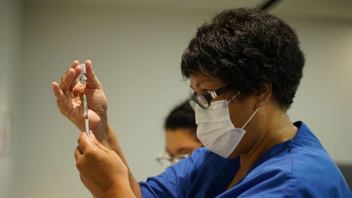 A nurse gets ready to immunise one of the first people New Zealand to get the Covid jab. Photo / Supplied