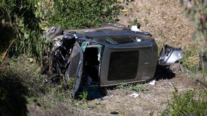 A vehicle rests on its side after a rollover accident involving golfer Tiger Woods along a road in the Rancho Palos Verdes suburb of Los Angeles. (Photo / AP)