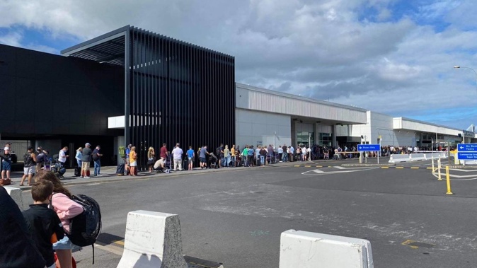 The queue at Auckland Airport was a couple of hundred metres long this morning causing lengthy delays for some travellers. Photo / Lauren Mabbett
