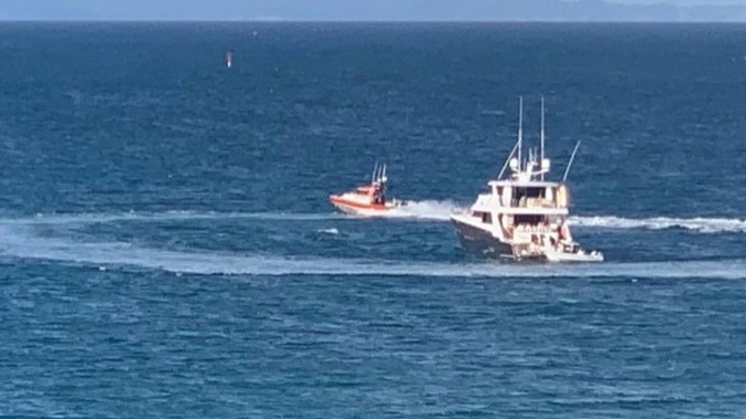 A circle is left in the water when a coastguard vessel leaves a rendezvous with a luxury launch at a Waiheke Island bay. Photo / Supplied