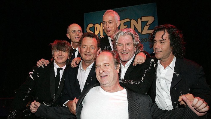 Split Enz pose with promotor Michael Gudinski in 2006. Photo / Getty Images