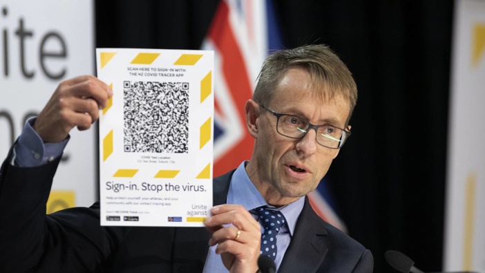 Director-General of Health, Dr Ashley Bloomfield with an example of a scan for the just released NZ Covid tracer App, at a Covid -19 press conference last year. Photo / Mark Mitchell
