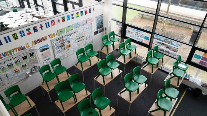 An empty classroom at Great Academy Ashton, as the school prepares for its reopening on March 8 after the latest lockdown curb the spread of the outbreak. (Photo / AP)