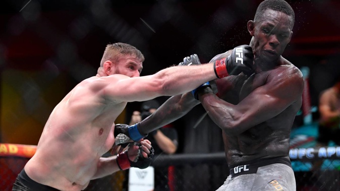 Jan Blachowicz lands a punch against Israel Adesanya. Photo / Getty