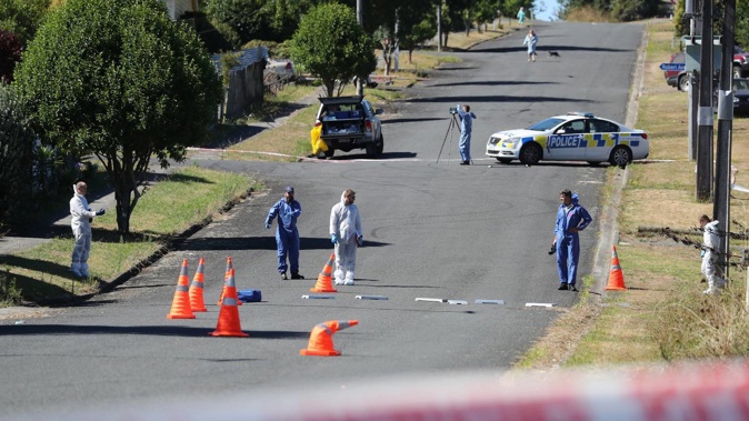 Police and forensic staff examine the scene at Pukemiro where Phillip Macpherson died on March 2019. Photo / NZ Herald