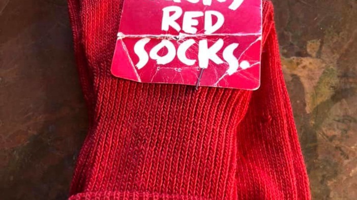 These lucky red socks from 1995 are up for sale in Queenstown. Photo / Supplied