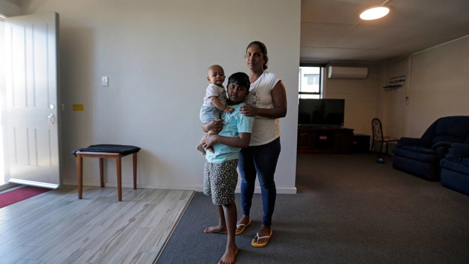 Widow Buddhini Sooriyaarachchi and her two children, Vinuga, 8, and Vinuth, 7 months, are at a loss about what to do after her husband Jeevaka Shayamal died suddenly aged 39. Photo / Alex Burton