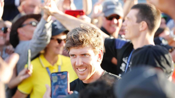 Team New Zealand helmsman Peter Burling was surrounded by adoring fans as he made his way to the America's Cup trophy presentation. Photo / Dean Purcell