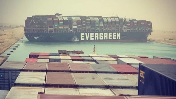 The massive container ship Ever Given is wedged across the Suez Canal, blocking the vital waterway. Photo / Julianne Cona / Instagram