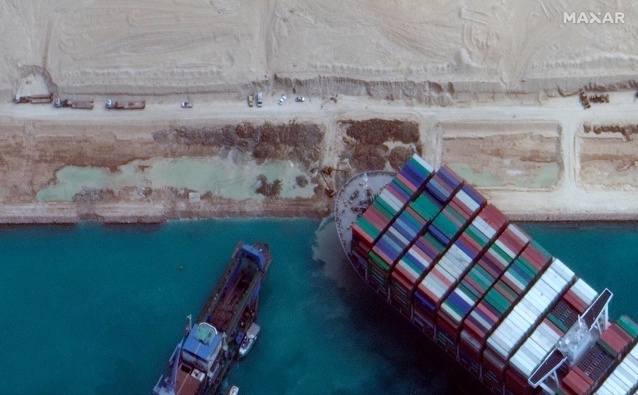 A satellite image shows excavation work in an atempt to free the cargo ship MV Ever Given. Photo / Maxar Technologies, via AP