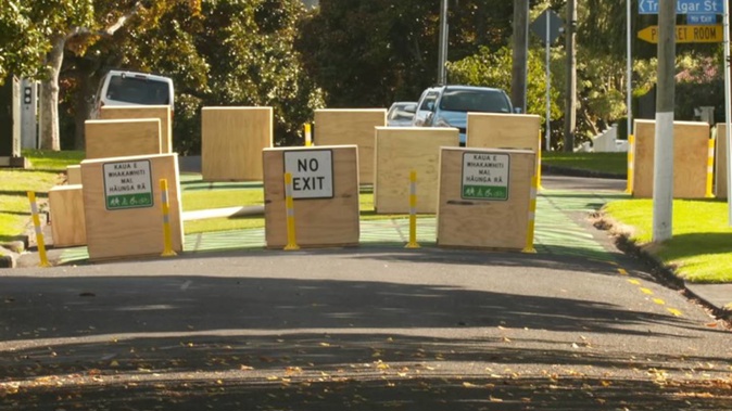 Plywood roadblocks have turned thoroughfares into cul de sacs in the Onehunga low traffic area trial. Photo / Nick Monro, RNZ