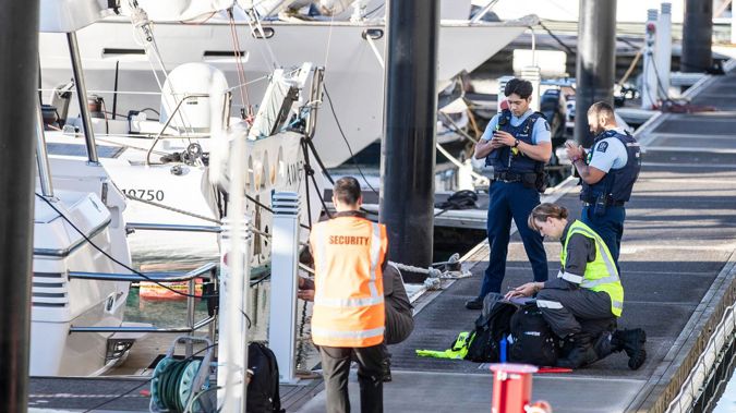 Police and maritime investigators try to piece together events leading up to a 25-year-old going overboard from charter boat yesterday. Photo / Michael Craig