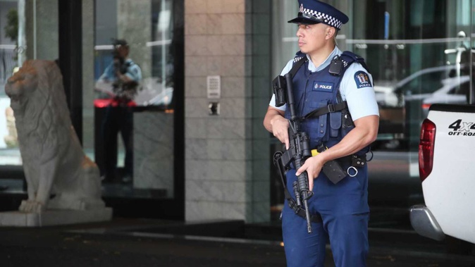 Armed police stand guard outside the Sofitel Hotel on Auckland's Viaduct this morning. Photo / Jason Oxenham