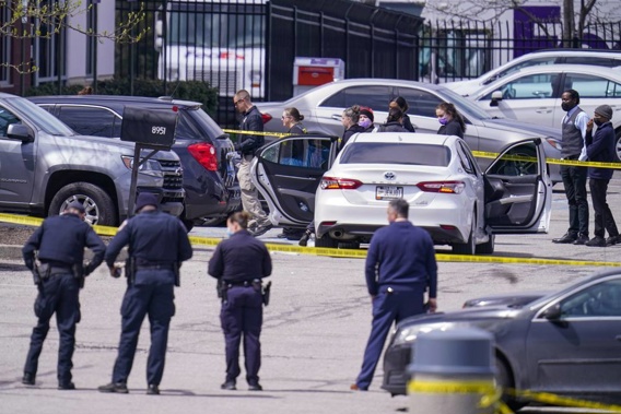 Law enforcement confer at the scene. Photo / AP